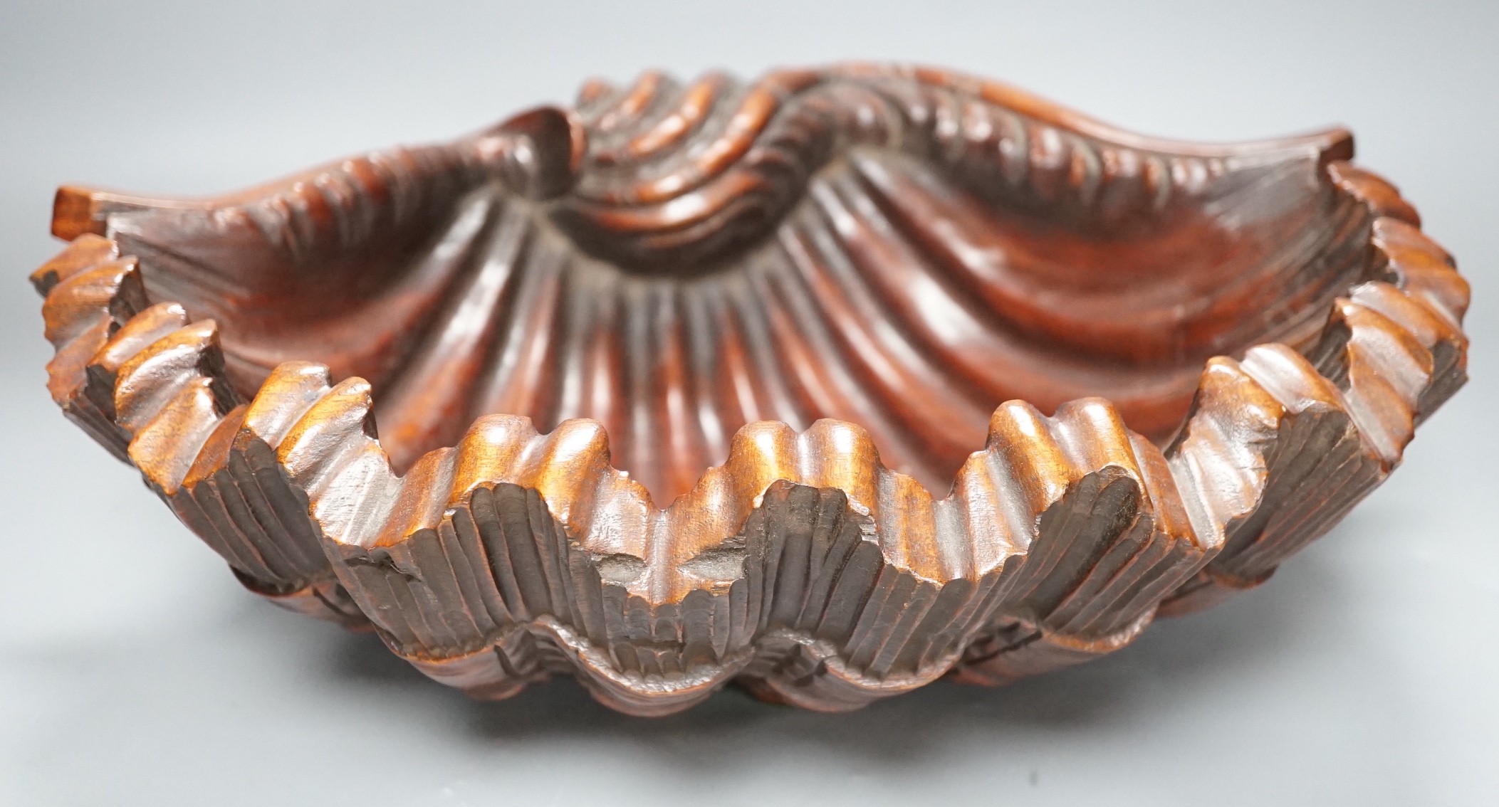 A large 20th century carved walnut scallop shell dish, 41.5cm wide